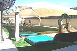 Playground shades :: This jumbo shade structure and canopy covers several play structures.