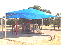 Playground shades :: This blue rectangle shade and canopy covers the play structure with room to spare.