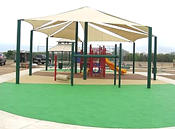Playground shades :: This unique shade structure and canopy combines a septagon shape and a sail design.