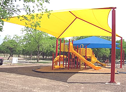 Playground shades :: This colorful shade structure and canopy brightens the playground but blocks out the sun.