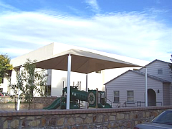 Playground shades :: This white shade structure or canopy leaves plenty of room above the play structure.